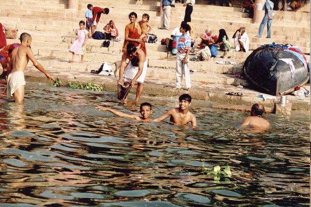 varanasi kids splashing in the ganges